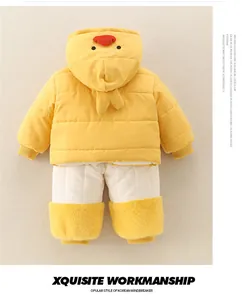 Flat lay of baby winter two-piece set featuring yellow duck hooded jacket and warm pants