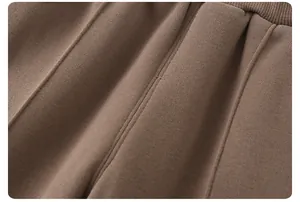 Detail of baby winter pants featuring elastic ribbed waistband and vertical seam stitching