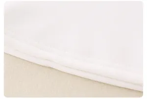Detailed close-up of white knitted fabric with neat double-needle stitching hem