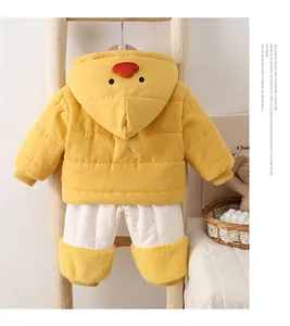Detail of baby winter padded jacket with yellow chick hood and warm quilted pants