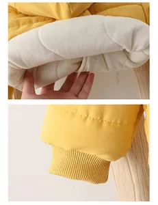 Detail of yellow toddler winter jacket showing warm white fleece lining and ribbed cuffs