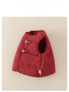 Detail of red quilted baby down vest with traditional Chinese gourd buttons and gold text