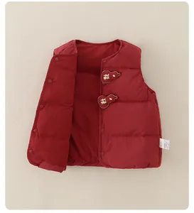 Detail of red quilted down vest for babies with traditional gold Fu character embroidery