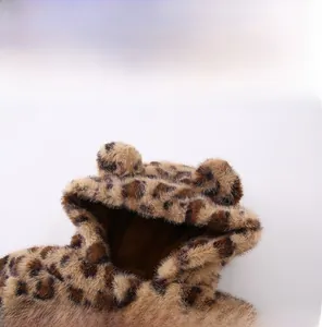 Detailed close-up of baby leopard print hoodie with plush ears and soft faux fur fabric