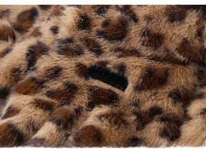 Macro detail of plush leopard faux fur texture with a black MS:DESIGN woven label