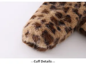 Macro shot of faux fur sleeve cuffs featuring classic brown and black leopard print patterns