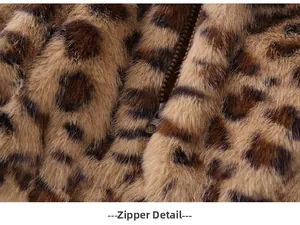 Close-up of metal zipper on baby leopard print faux fur hooded jacket with plush texture