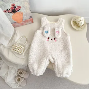 Detail of baby winter romper with fleece fabric and cute rabbit embroidery decoration