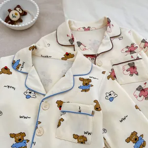 Cute cartoon bear printed kids pajama sets with button-up tops in warm beige cotton