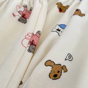 Cozy cream cotton baby pajamas featuring cute cartoon bears and puppies print