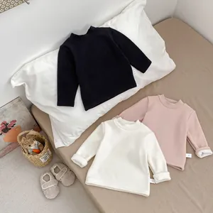 Detail view of thick fleece-lined long sleeve thermal shirts for toddlers in three colors