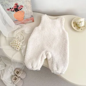 Detail view of plush white fleece baby romper with soft lamb wool texture for winter