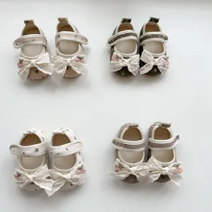 Matrix of baby floral Mary Janes with lace bows and cherry details on white background