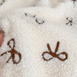 Winter baby fleece jumpsuit featuring warm teddy velvet fabric with a brown bow embroidery