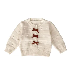 Kleinkind Mädchen Strickjacke mit braunen Schleifen und weißen Knöpfen in Cremeweiß
