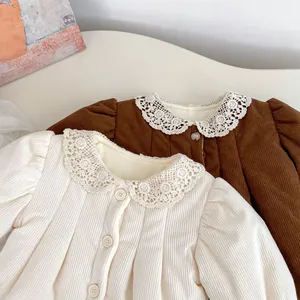 Close-up of girls corduroy winter dresses featuring lace collars and warm lining
