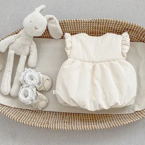 Cream baby gift set with bubble textured romper, lace shoes and long-eared bunny plush