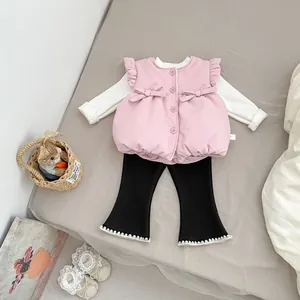 Pink quilted vest with bow, white top and black flared lace pants for baby girls