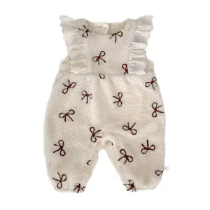 Winter fleece baby romper set in creamy white with brown bow prints and lace trim details