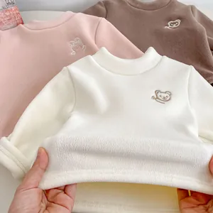 Detail of soft fleece lining on cute embroidered bear sweatshirts for children