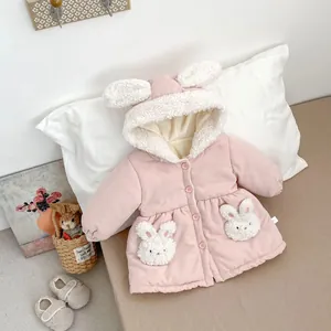 Detail of pink toddler winter coat with plush rabbit ears hood and fluffy bunny pockets