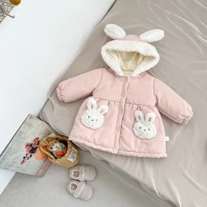 Detail of pink toddler winter coat featuring 3D rabbit ears on hood and fuzzy pockets