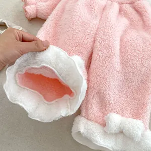 Pink coral fleece baby pajama set with plush bows and warm lamb wool trim