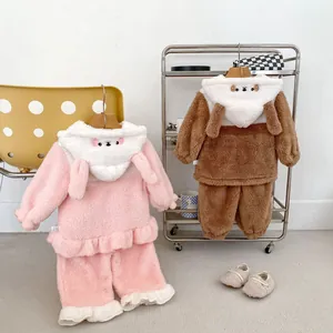 Detail of cute animal-themed hooded coral fleece pajamas for toddlers with warm plush fabric