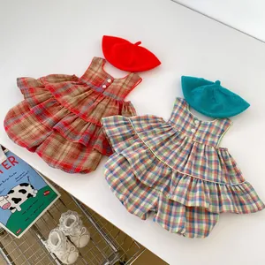 Flat lay of baby girls plaid top and bloomer sets with matching berets and lace shoes
