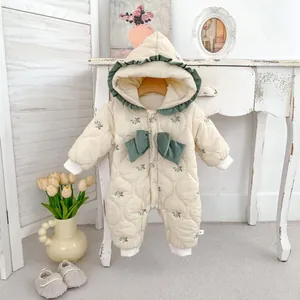 Floral padded baby hooded romper in cream with green bow and quilted texture
