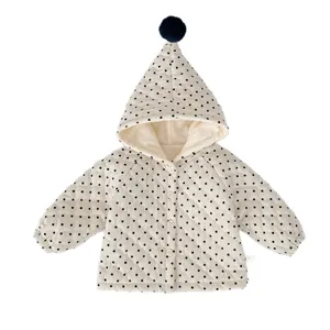 Winter infant hooded puffer jacket with black polka dots and pointed pompom hood