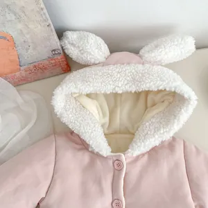 Close-up of pink toddler winter coat featuring cute bunny ears and soft white fleece lining