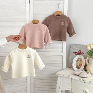 Detail of warm fleece-lined baby sweatshirts with cute animal embroidery and thick cuffs