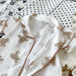 Baby short-sleeve cotton gauze romper with cute brown bear prints for summer comfort