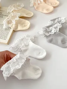 Detail view of cotton mesh toddler socks with delicate floral lace trim in multiple colors