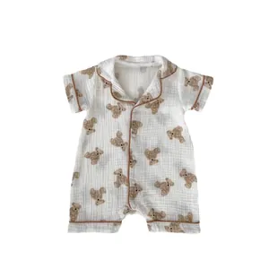 Short sleeve baby romper in white cotton gauze with cute brown bear prints and collar