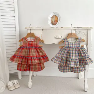 Detail of girls plaid sleeveless top and bloomers set in vintage cotton fabric
