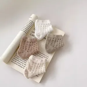 Breathable hollow mesh cotton baby socks in four neutral colors for summer wear