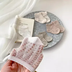 Breathable mesh summer socks for babies in solid colors showing stretch and texture