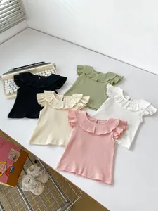Detailed flat lay of baby flutter sleeve tops in five soft colors with ruffled collars