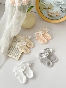Lace ruffle princess mesh socks for baby girls in white, apricot, and beige tones