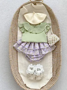 Detail of baby girl flutter sleeve ribbed top and floral layered bloomers set