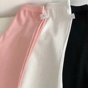 Detailed macro view of soft ribbed knit fabric texture on toddler flared leggings