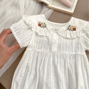 Baby girl white bodysuit with floral embroidery and ruffle collar in ribbed fabric