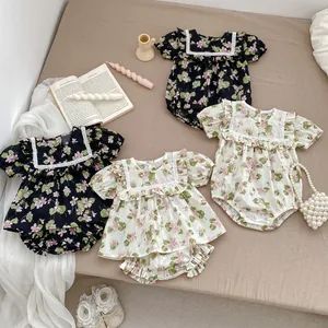 Baby floral romper set with lace trim and puff sleeves in navy and off-white colors