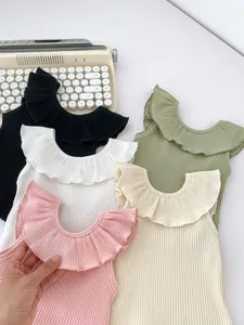 Detailed flat lay of ruffled sleeveless rib-knit cotton tops in five pastel colors