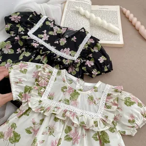 Floral print baby girl rompers in black and cream colors with ruffled lace collar details