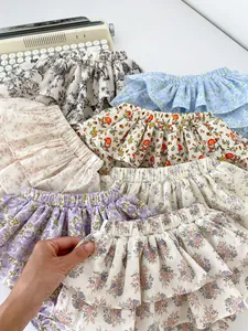 Variety of floral ruffle baby bloomers featuring diverse vintage patterns and cotton fabric