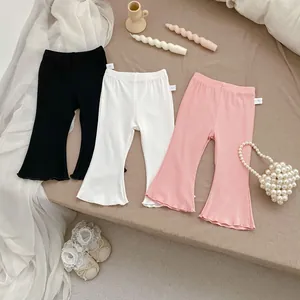 Detailed flat lay of toddler ribbed flare leggings in black, white, and pink colors