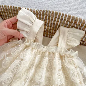 Detail of baby floral lace dress with flutter sleeves and 3D rose mesh texture